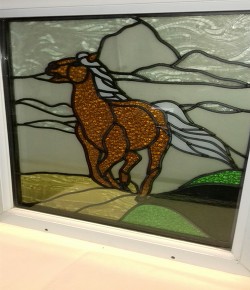Stained glass horse and clouds