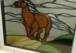 Stained glass horse and clouds